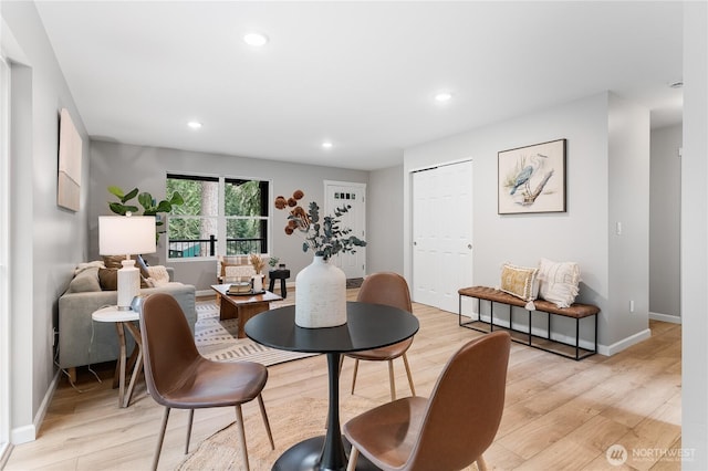 dining area featuring recessed lighting, baseboards, and light wood-style floors