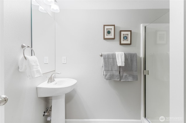 full bath featuring an enclosed shower