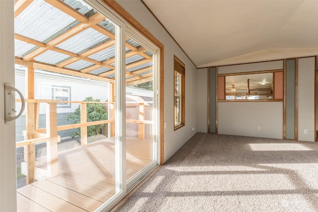 unfurnished sunroom featuring lofted ceiling