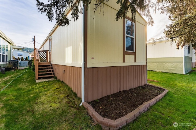 view of property exterior with a lawn