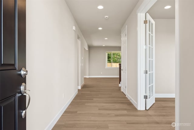 corridor featuring light hardwood / wood-style flooring