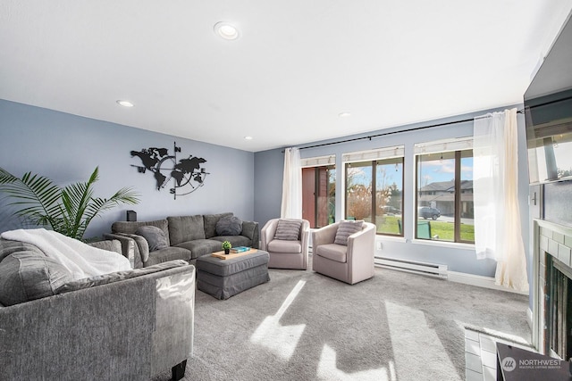 living room featuring a baseboard radiator, light colored carpet, and a high end fireplace