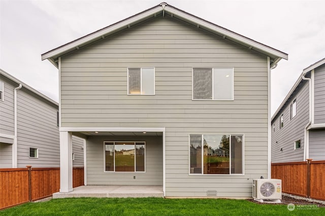 back of house featuring a yard, a fenced backyard, a patio, and ac unit