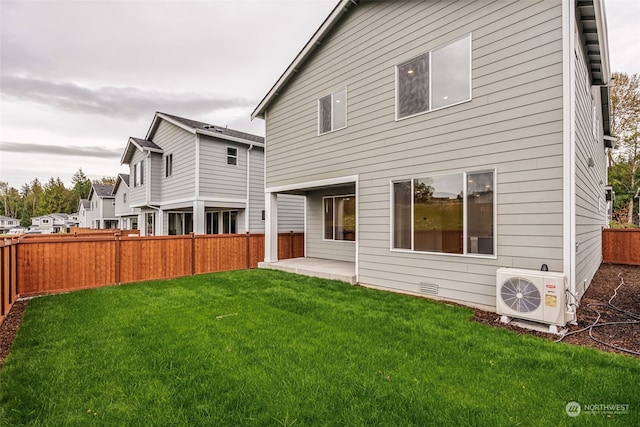 back of property with a patio, a fenced backyard, crawl space, ac unit, and a lawn