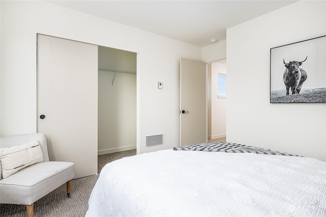 carpeted bedroom with a closet