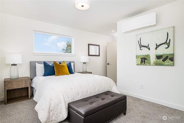 bedroom with carpet floors and a wall mounted air conditioner