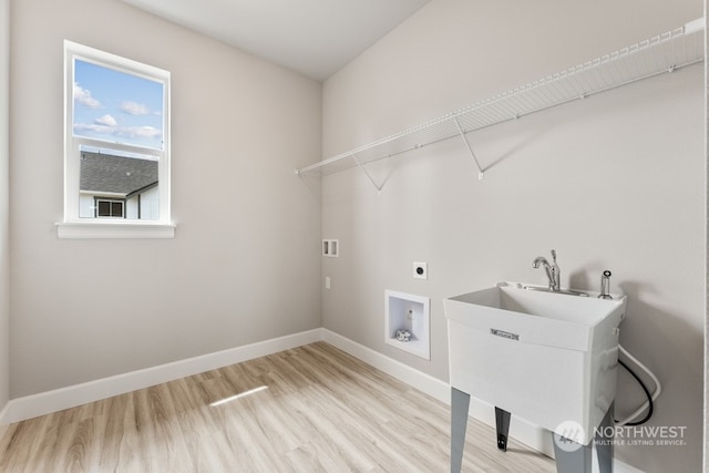 laundry room with sink, hookup for an electric dryer, light wood-type flooring, and washer hookup