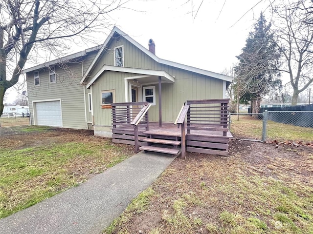 view of front of home featuring a garage and a deck