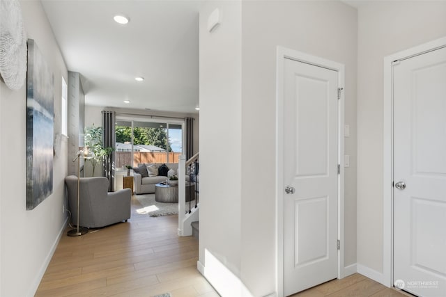 hall with light hardwood / wood-style floors