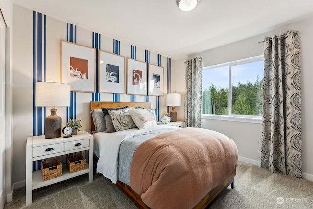 bedroom with dark colored carpet