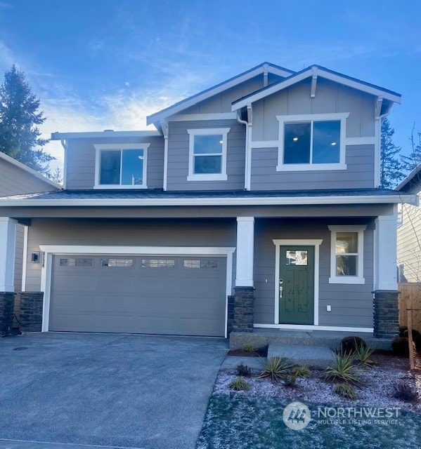 craftsman-style home with a garage and covered porch