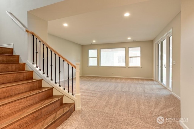 interior space with a healthy amount of sunlight and carpet