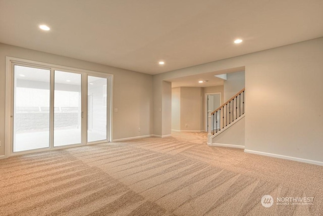 unfurnished living room with light carpet