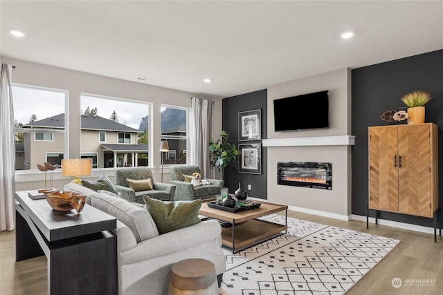 living room with light hardwood / wood-style flooring