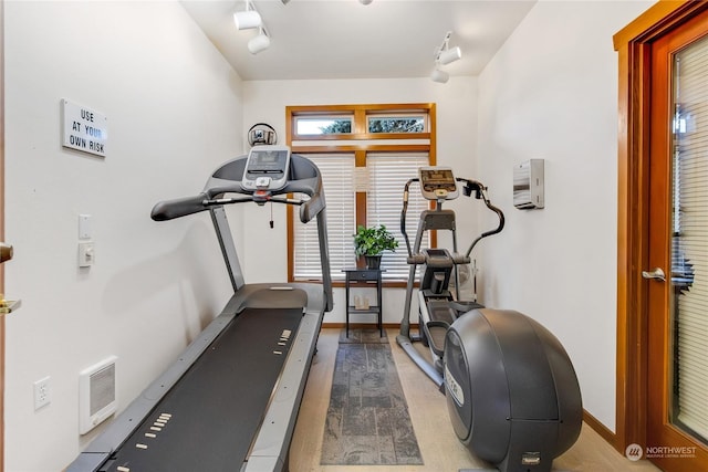 workout area with track lighting