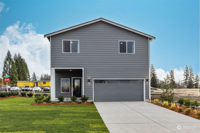 view of front of house featuring a garage and a front lawn