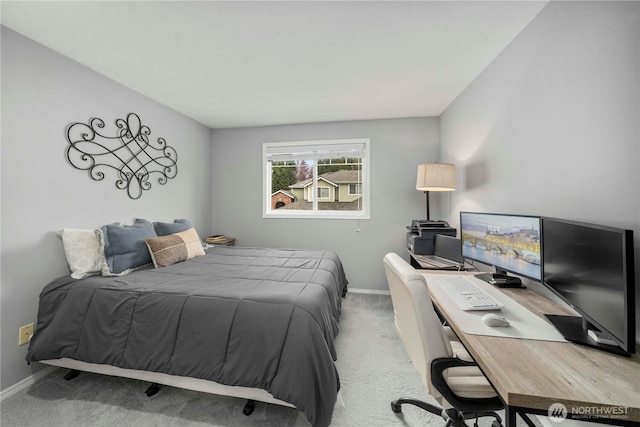 bedroom with baseboards and carpet floors