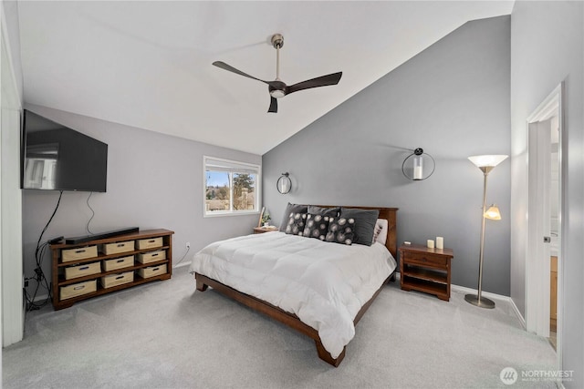 carpeted bedroom with baseboards, lofted ceiling, and ceiling fan