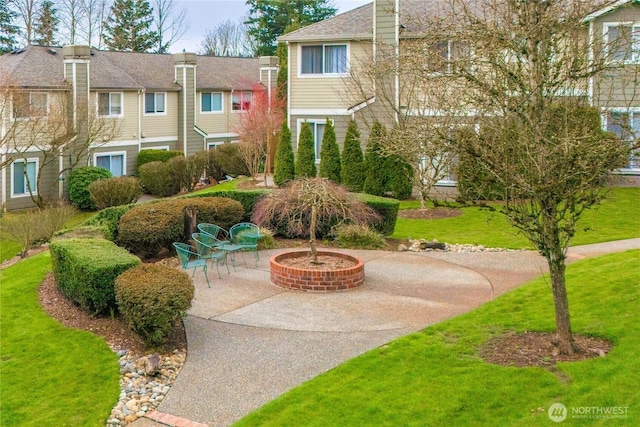 surrounding community featuring a yard and a patio area