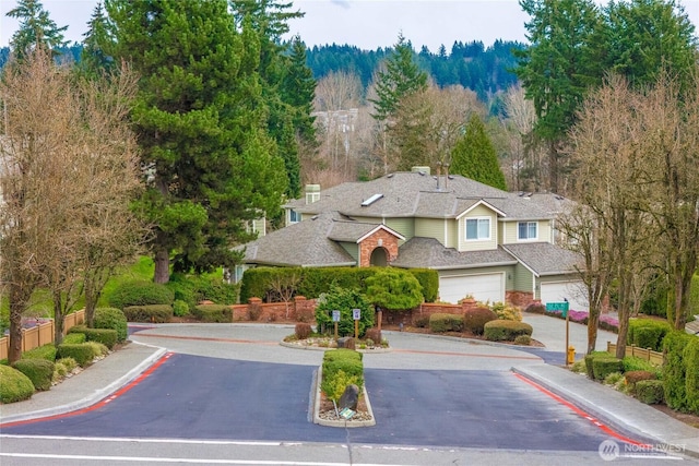 birds eye view of property with a forest view