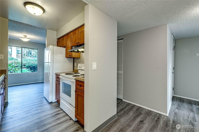 kitchen featuring white range with electric stovetop, hardwood / wood-style floors, and a textured ceiling