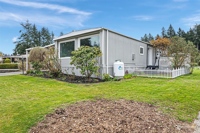 view of home's exterior with a lawn