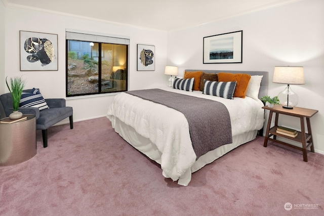 bedroom featuring ornamental molding and carpet floors