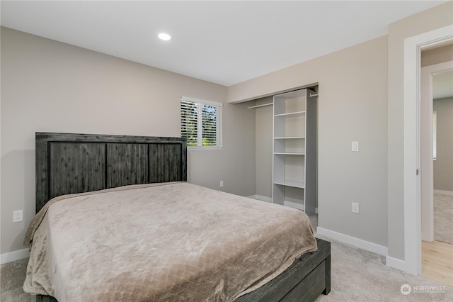 carpeted bedroom featuring a closet