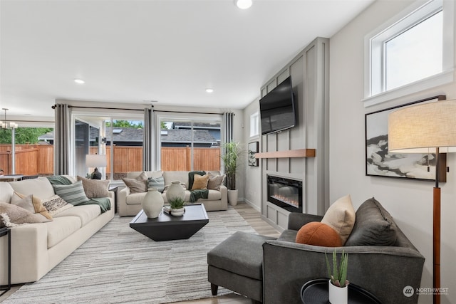 living room featuring a fireplace and light hardwood / wood-style floors