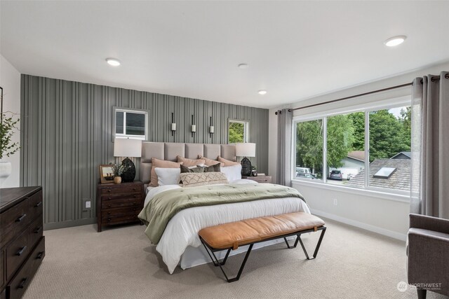 carpeted bedroom with multiple windows