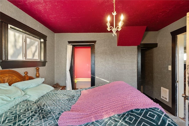 bedroom featuring a chandelier