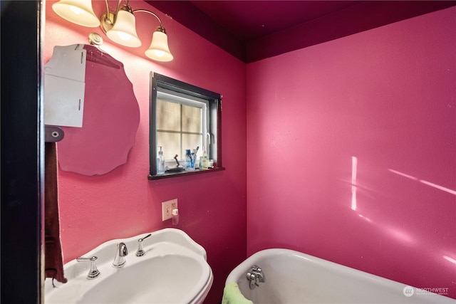 bathroom featuring a bathing tub and sink