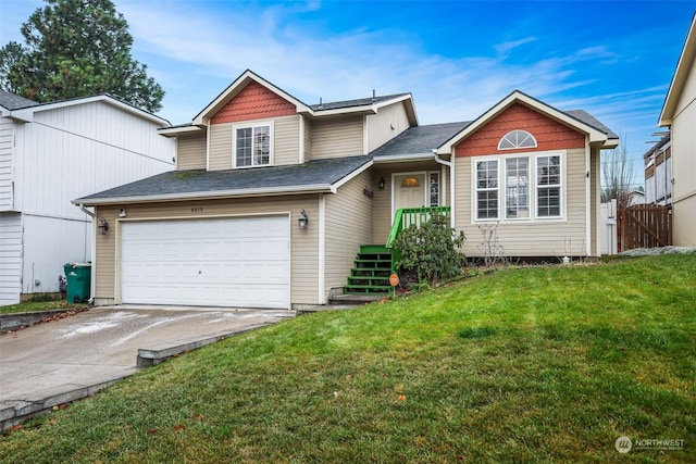 view of front facade featuring a garage and a front lawn