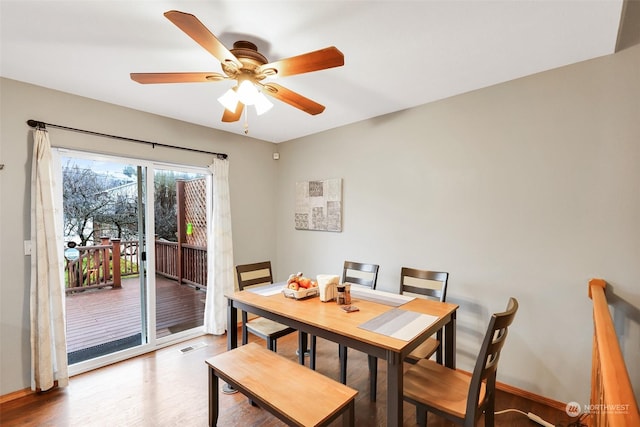 dining area featuring ceiling fan and hardwood / wood-style floors