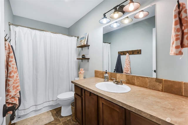 bathroom with vanity, toilet, and a shower with curtain