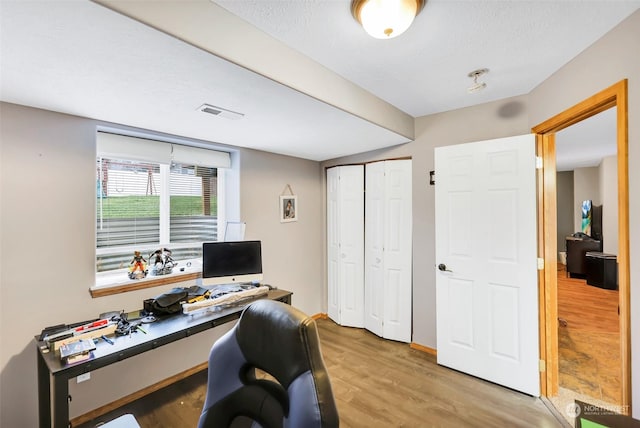 office space with hardwood / wood-style floors