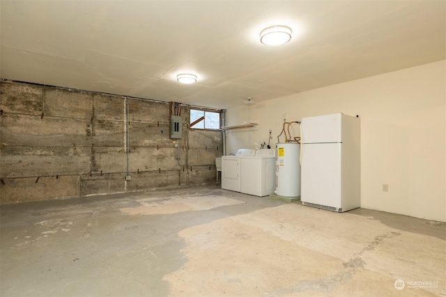 basement with white fridge, electric water heater, electric panel, and washer and clothes dryer