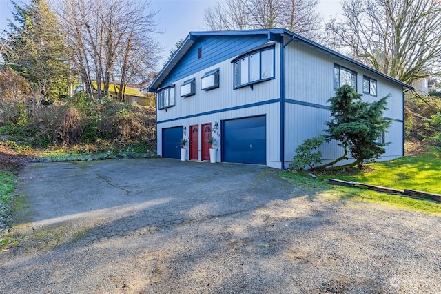 view of property exterior with a garage