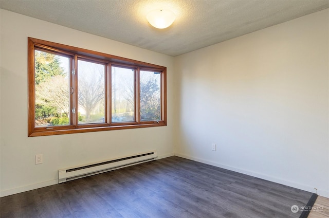 unfurnished room featuring dark hardwood / wood-style floors, a textured ceiling, and a baseboard heating unit