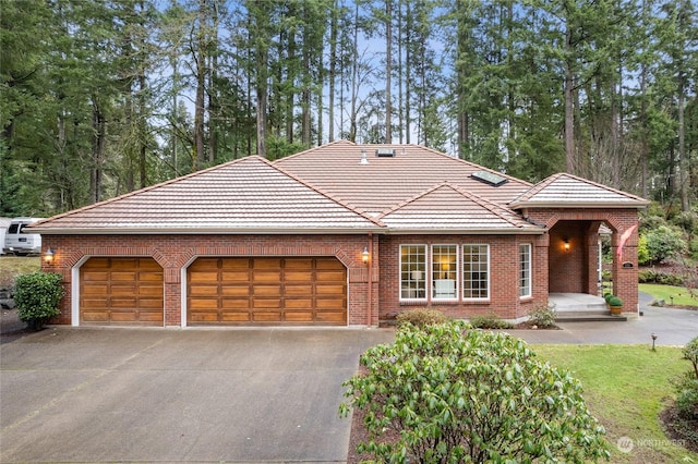 ranch-style home featuring a garage