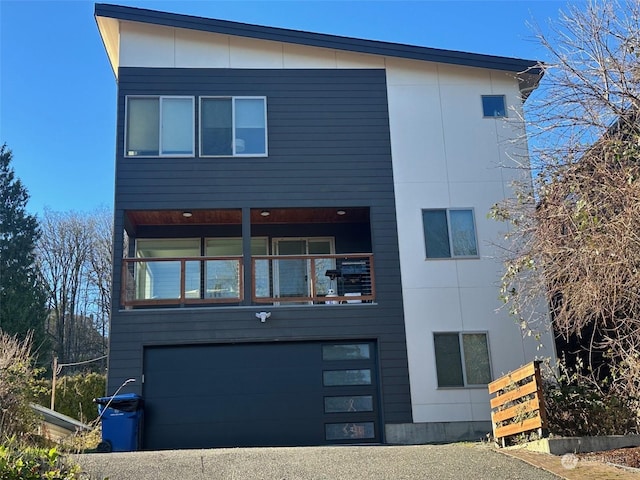 rear view of property with a garage