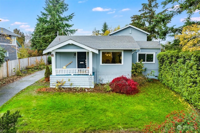 bungalow featuring a porch and a front yard