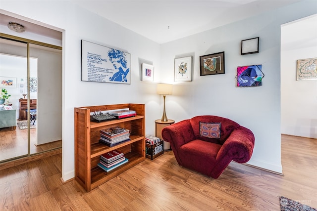 sitting room featuring hardwood / wood-style floors