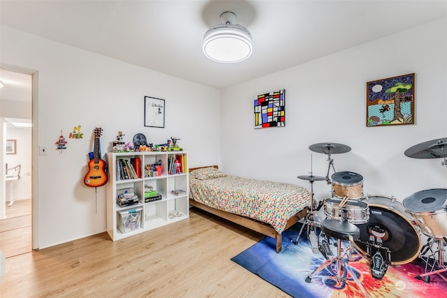 bedroom with wood-type flooring