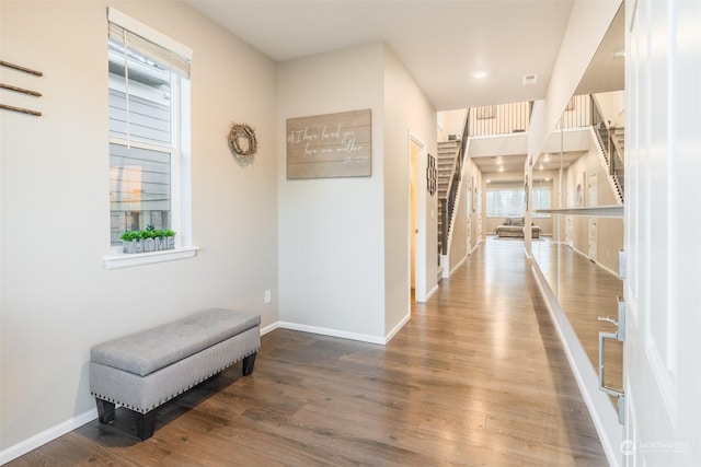 hallway with wood-type flooring