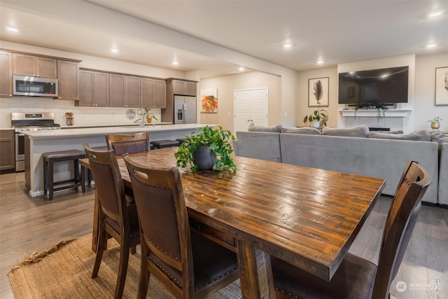 dining space with dark hardwood / wood-style floors