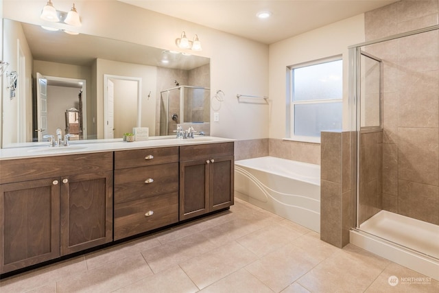 bathroom featuring vanity, tile patterned floors, and shower with separate bathtub