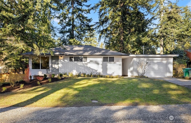 ranch-style house with a front yard and a garage