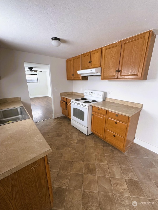 kitchen with sink, ceiling fan, a textured ceiling, and white electric range oven