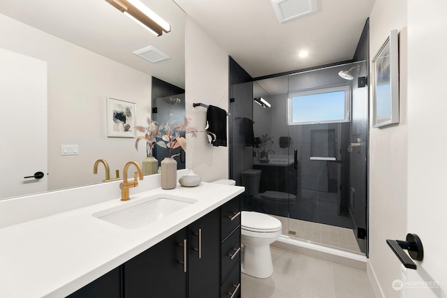 bathroom featuring vanity, an enclosed shower, tile patterned floors, and toilet